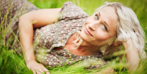 Beautiful woman lying on grass